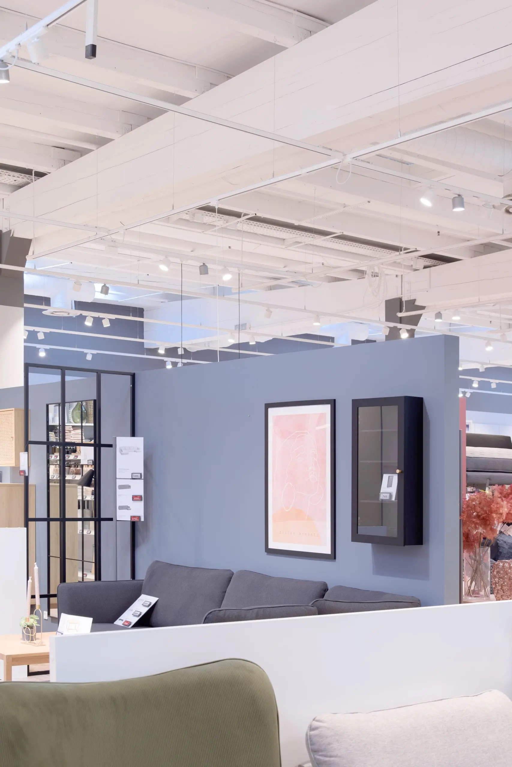 JYSK store with spotlights over furniture displays