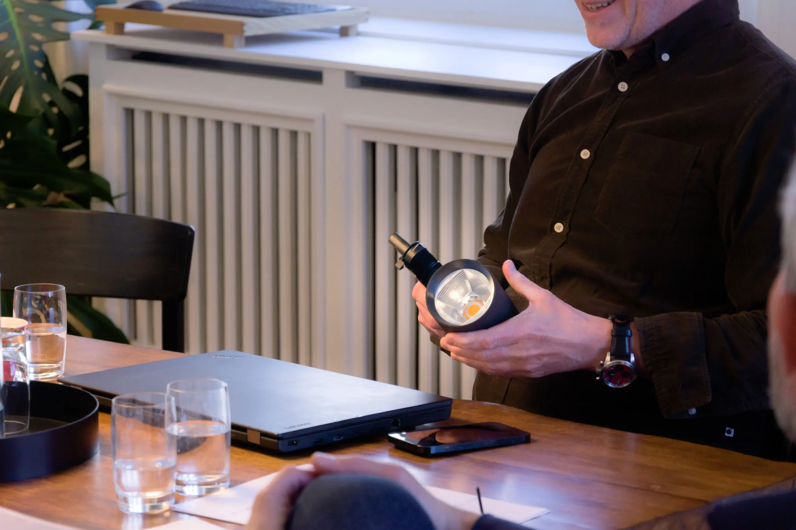 Lighting specialist presenting a fixture