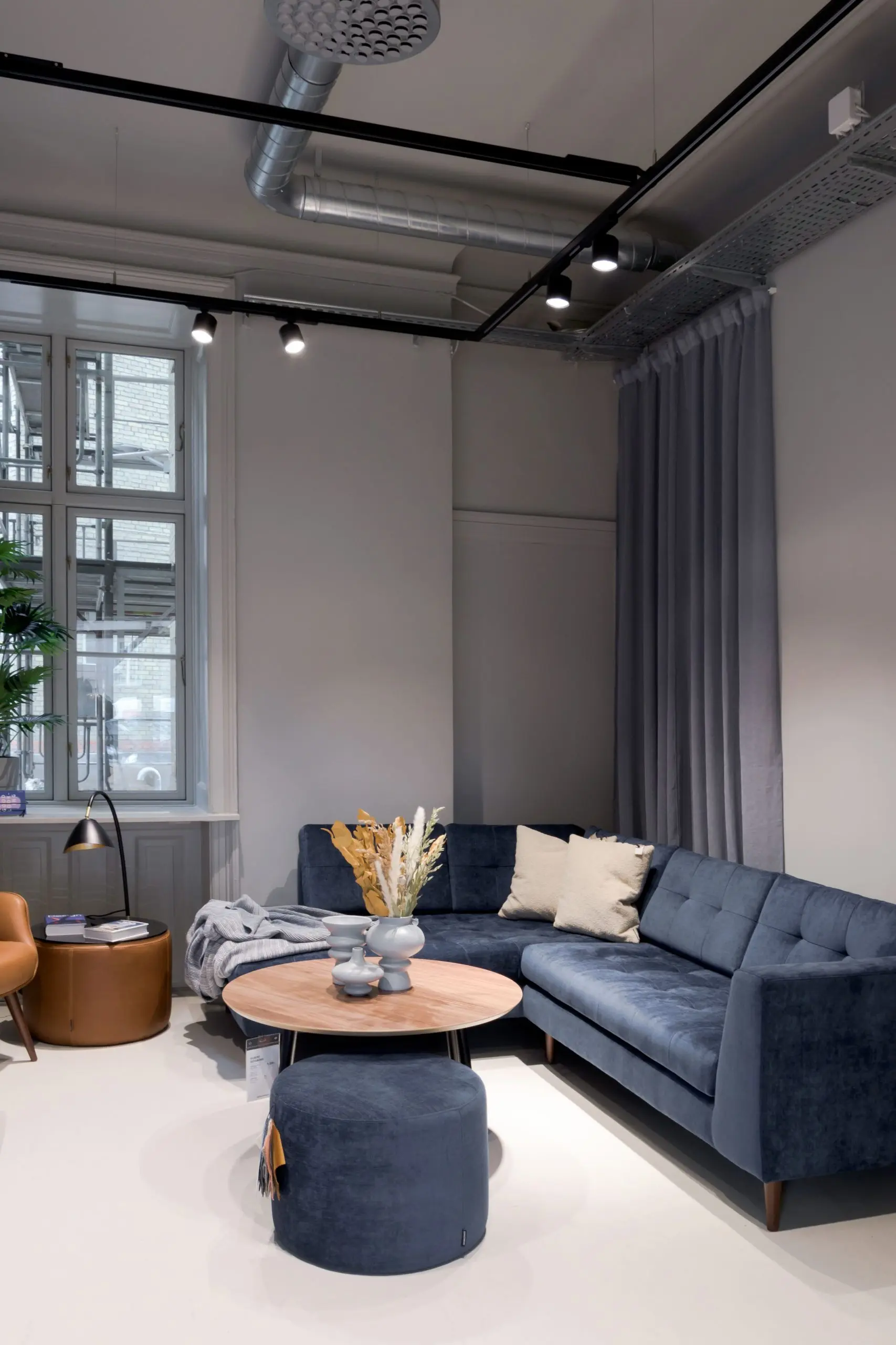 Sofa setting lit by spotlights