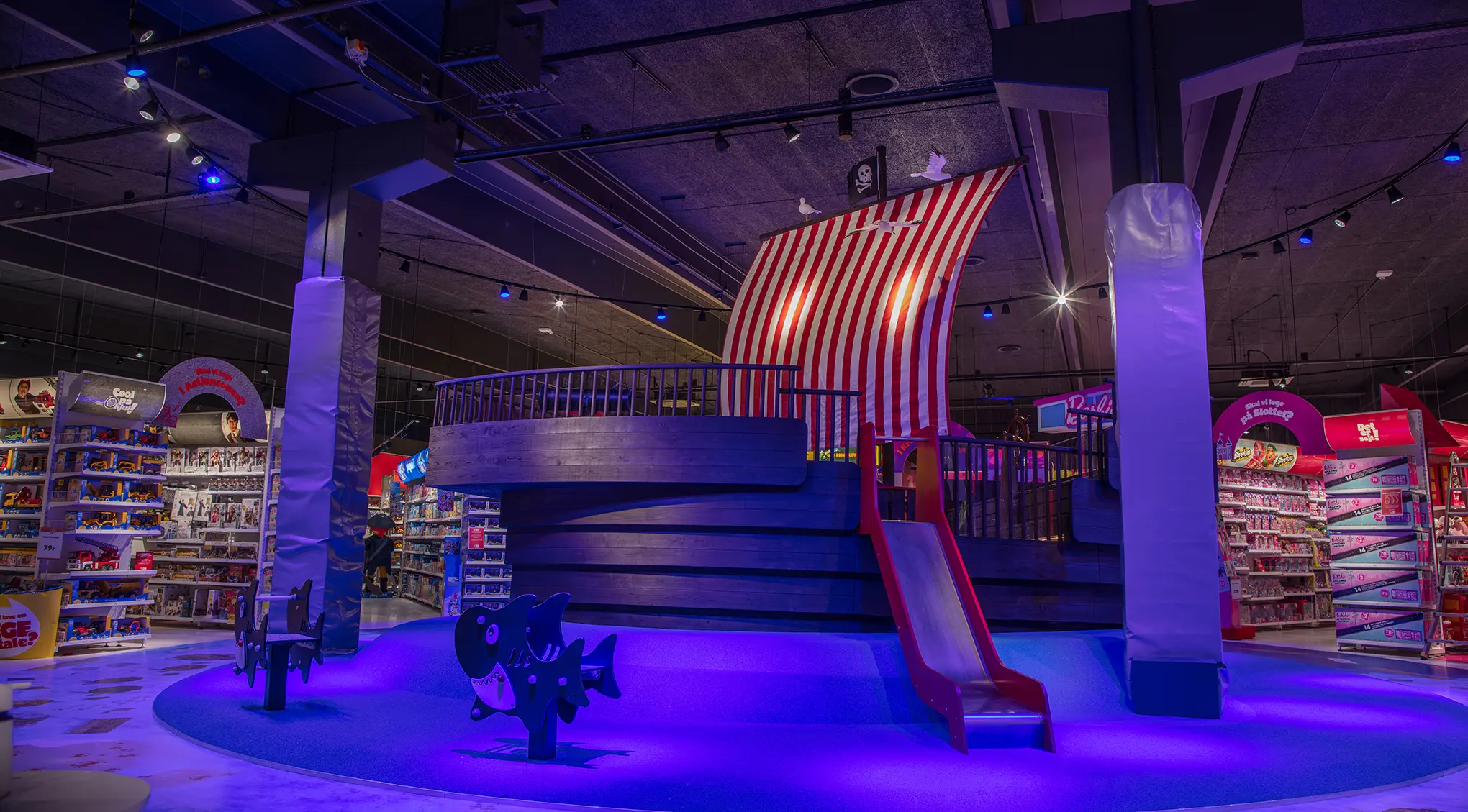 Play stage lit in blue in a toy store
