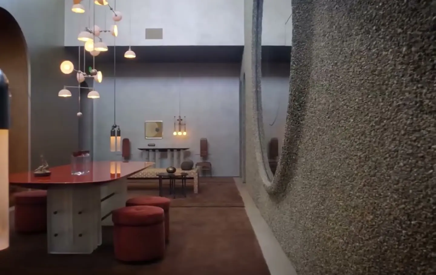 Warmly lit interior with sculptural pendant lights